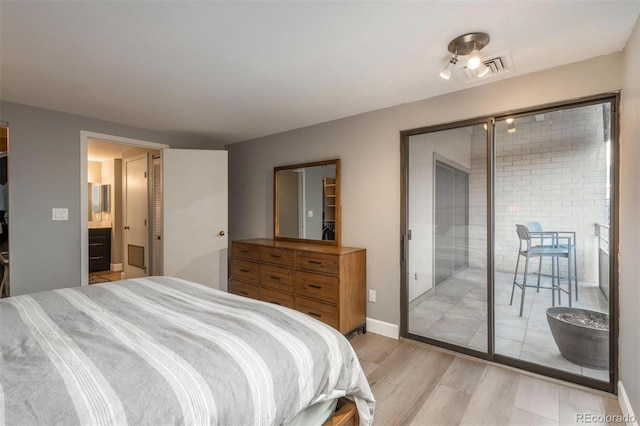 bedroom with access to outside, baseboards, and light wood finished floors