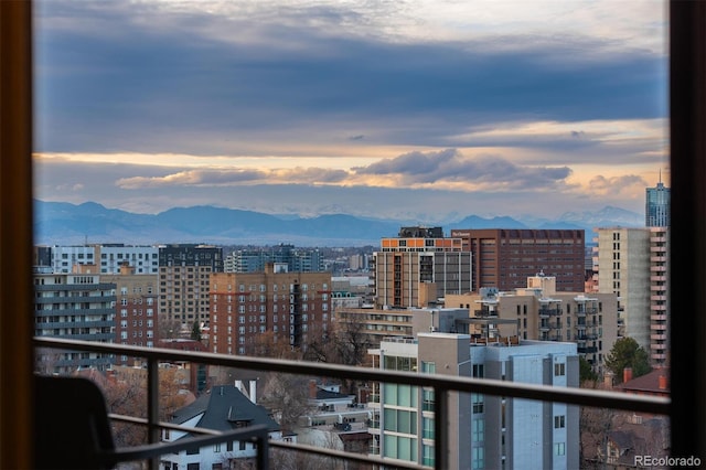 balcony featuring a city view and a mountain view