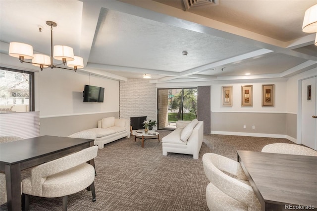 living room with baseboards, carpet, beam ceiling, an inviting chandelier, and coffered ceiling