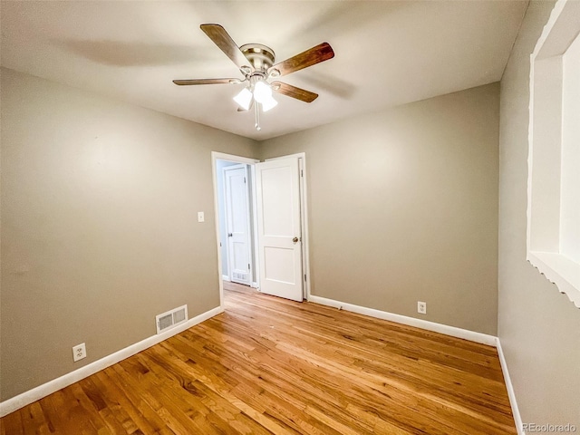 unfurnished room featuring ceiling fan and light wood-type flooring