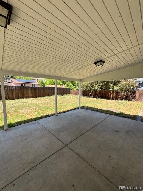 2513 S Crystal St, Aurora, CO 80014 - fenced backyard with a patio area