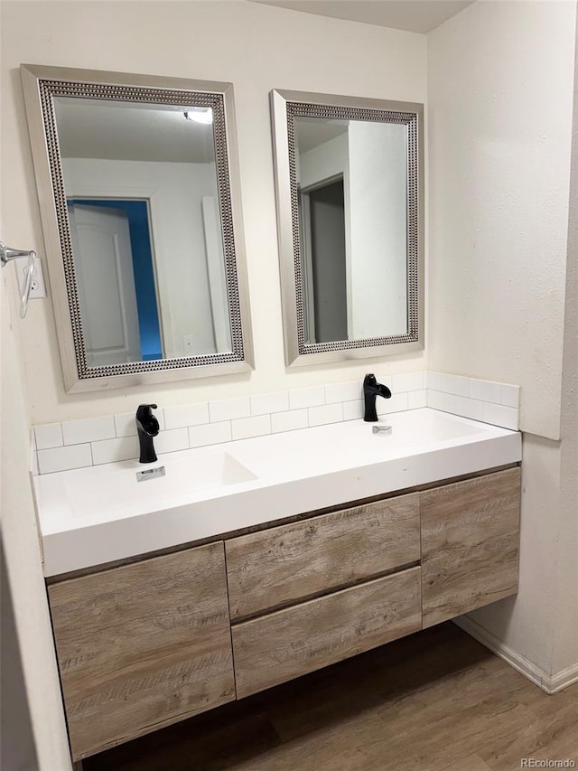 2513 S Crystal St, Aurora, CO 80014 - bathroom with double vanity and wood finished floors
