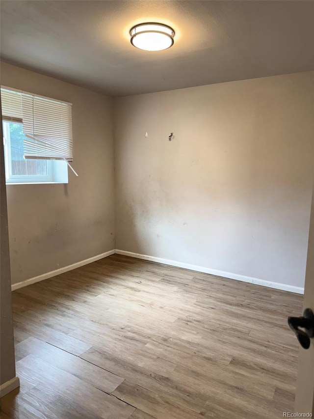 2513 S Crystal St, Aurora, CO 80014 - spare room with wood finished floors and baseboards
