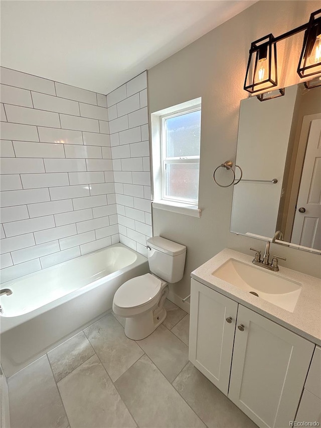 full bathroom featuring vanity, toilet, and tiled shower / bath