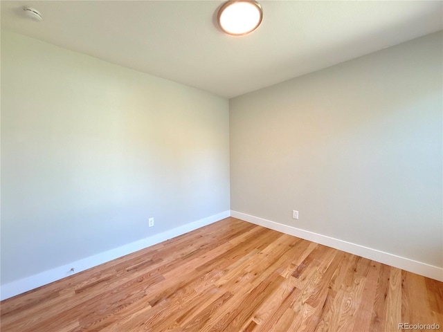 spare room featuring light hardwood / wood-style floors