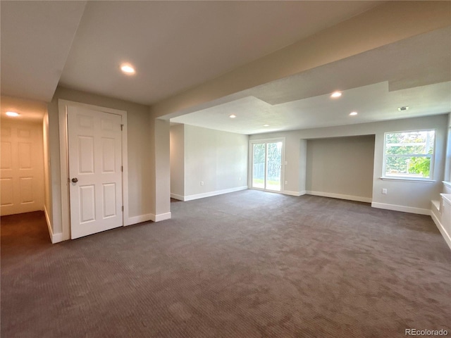 carpeted empty room featuring a healthy amount of sunlight