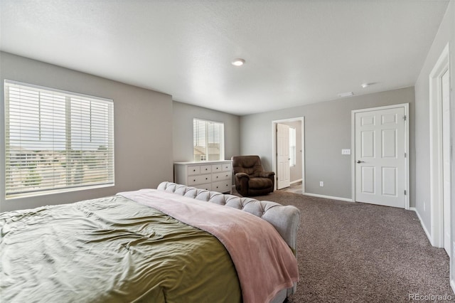 bedroom with carpet flooring and baseboards