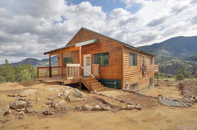18340 S Lake Rd, Buena Vista, CO 81211 - chalet / cabin with faux log siding and a deck with mountain view