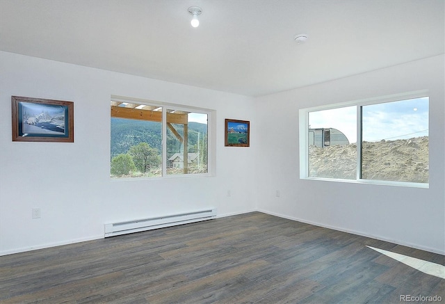 18340 S Lake Rd, Buena Vista, CO 81211 - empty room with baseboard heating, dark wood finished floors, baseboards, and a smoke detector