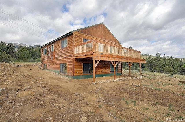 18340 S Lake Rd, Buena Vista, CO 81211 - rear view of house featuring a wooden deck and log veneer siding