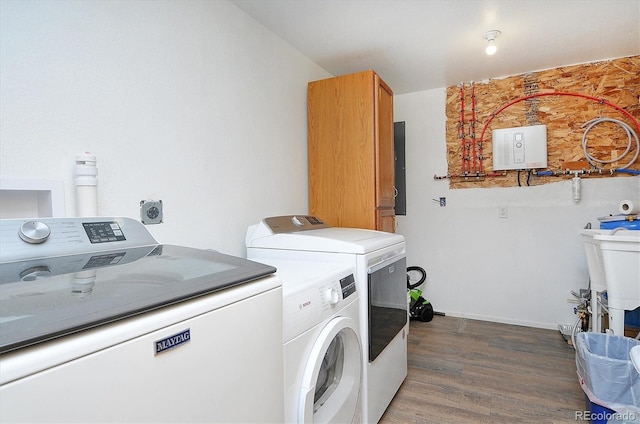 18340 S Lake Rd, Buena Vista, CO 81211 - washroom featuring washing machine and clothes dryer, wood finished floors, and electric panel