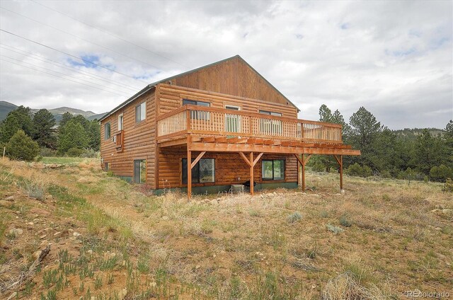 18340 S Lake Rd, Buena Vista, CO 81211 - rear view of house with a deck with mountain view and faux log siding
