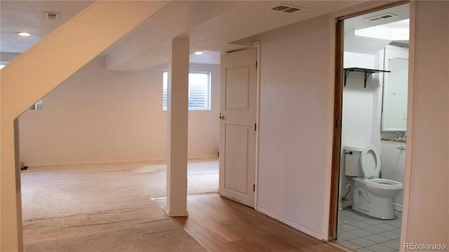 bonus room with baseboards, recessed lighting, and visible vents