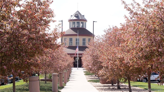 view of property's community with a yard