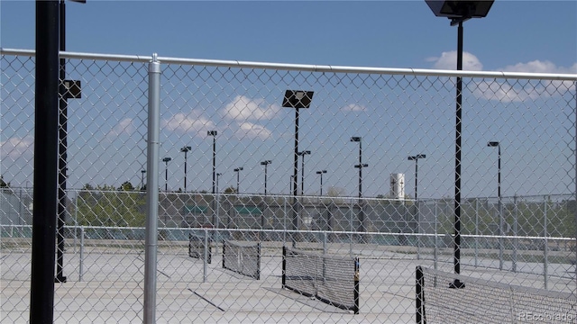 view of property's community featuring fence
