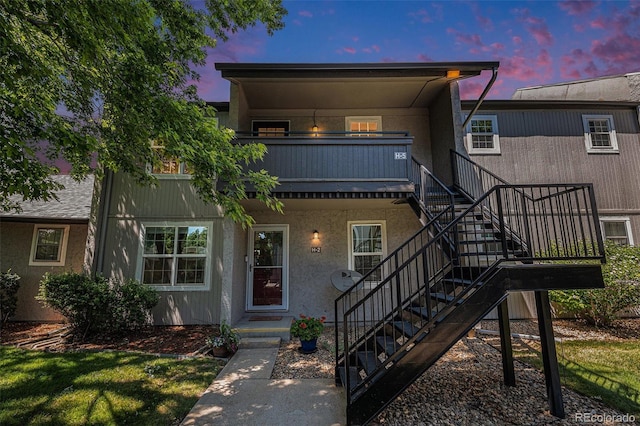 7165 S Gaylord St Unit H05, Centennial, CO 80122 - view of front facade featuring stairs and stucco siding