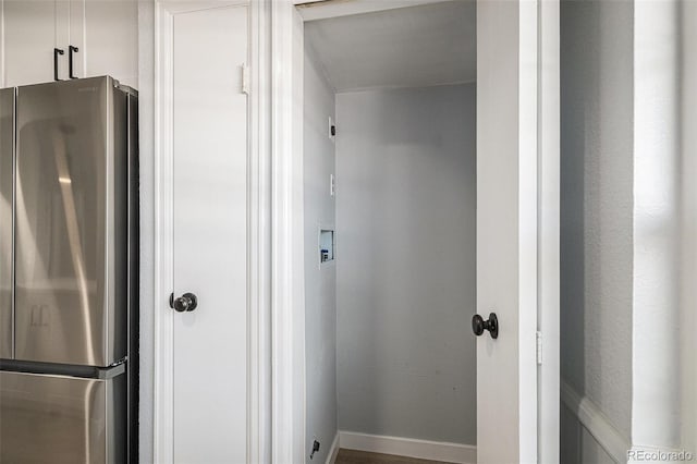 7165 S Gaylord St Unit H05, Centennial, CO 80122 - kitchen with freestanding refrigerator and white cabinets
