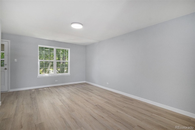 7165 S Gaylord St Unit H05, Centennial, CO 80122 - unfurnished room featuring light wood-type flooring and baseboards