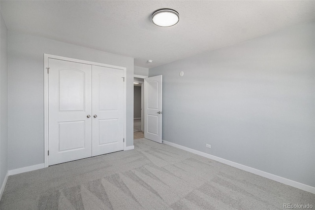 7165 S Gaylord St Unit H05, Centennial, CO 80122 - unfurnished bedroom featuring carpet floors and a closet