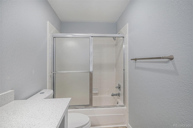 7165 S Gaylord St Unit H05, Centennial, CO 80122 - full bath featuring a textured wall, vanity, and bath / shower combo with glass door