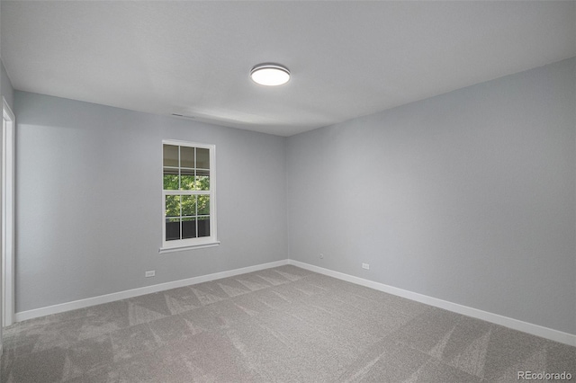 7165 S Gaylord St Unit H05, Centennial, CO 80122 - carpeted spare room featuring baseboards