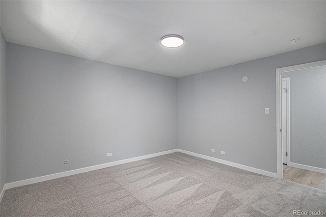 7165 S Gaylord St Unit H05, Centennial, CO 80122 - carpeted spare room featuring baseboards and a smoke detector
