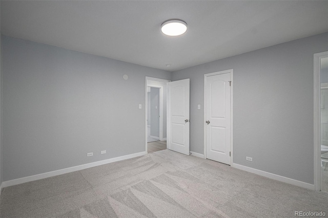 7165 S Gaylord St Unit H05, Centennial, CO 80122 - unfurnished bedroom featuring carpet and ensuite bath