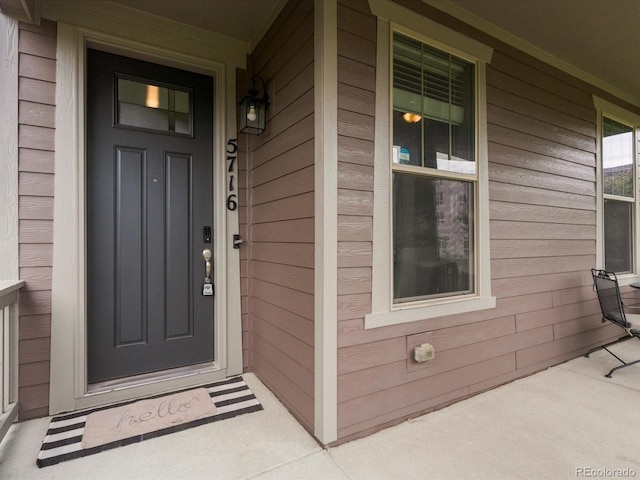 5716 Boston Ct, Denver, CO 80238 - doorway to property with a porch