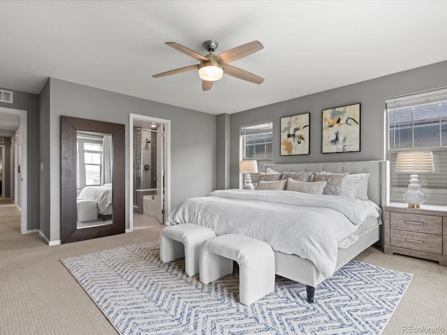 5716 Boston Ct, Denver, CO 80238 - bedroom featuring light carpet, baseboards, ceiling fan, and connected bathroom