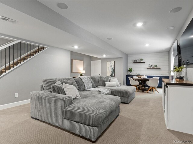 5716 Boston Ct, Denver, CO 80238 - living area featuring light carpet, stairs, recessed lighting, and baseboards