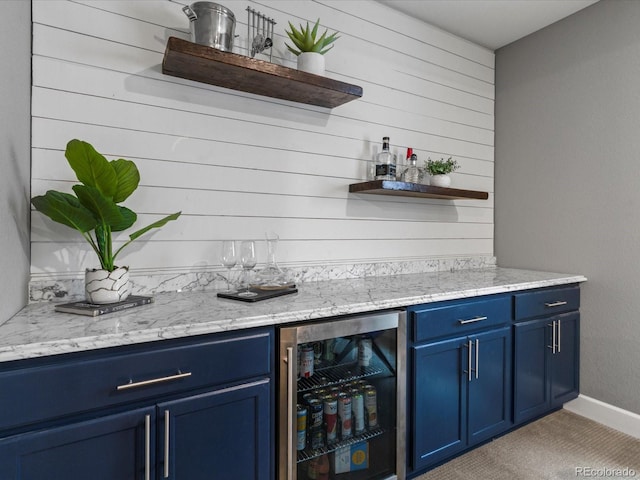 5716 Boston Ct, Denver, CO 80238 - indoor dry bar with wine cooler, light colored carpet, wood walls, and baseboards