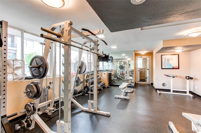 exercise room with a textured ceiling