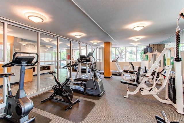 gym featuring a textured ceiling