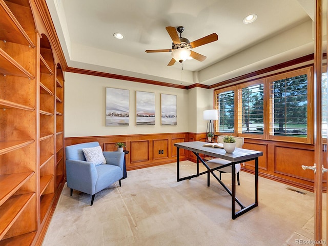 office space featuring a wainscoted wall, ceiling fan, recessed lighting, and light colored carpet