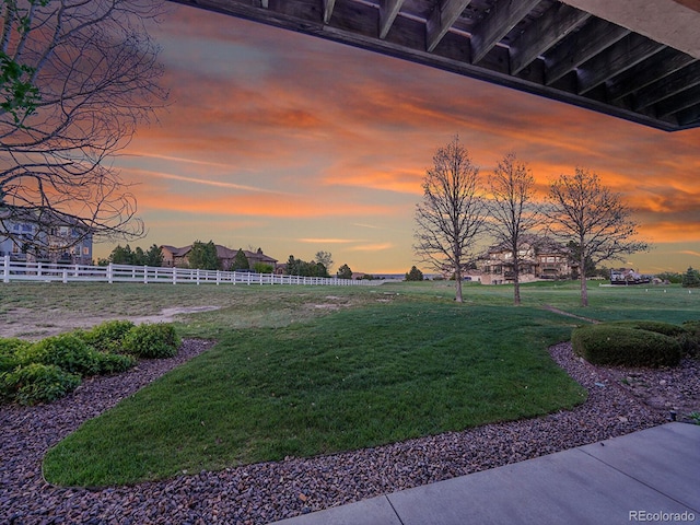 view of yard at dusk