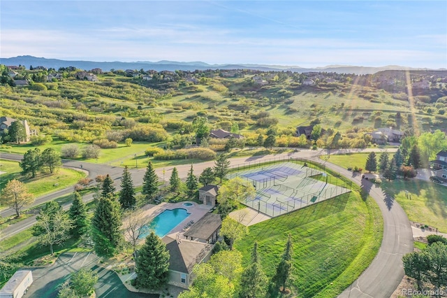 drone / aerial view of a pool and mountains