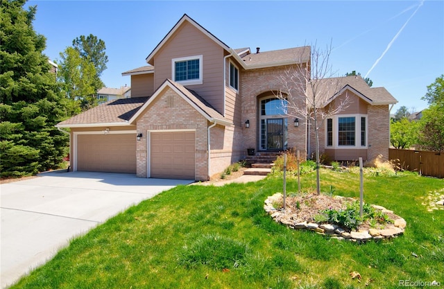 9688 Chesapeake St, Highlands Ranch, CO 80126 - traditional-style house with driveway, a front yard, roof with shingles, brick siding, and fence