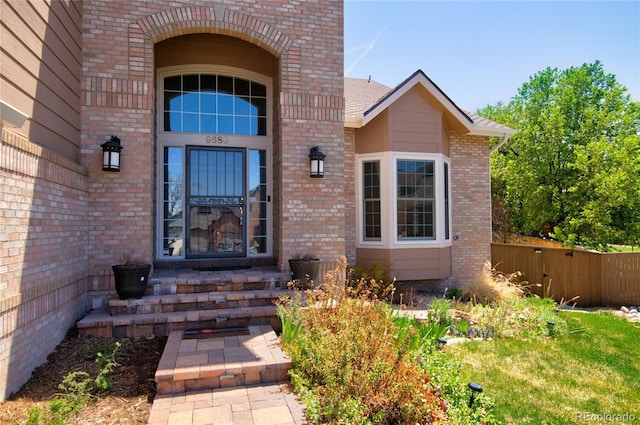 9688 Chesapeake St, Highlands Ranch, CO 80126 - view of exterior entry featuring brick siding and fence