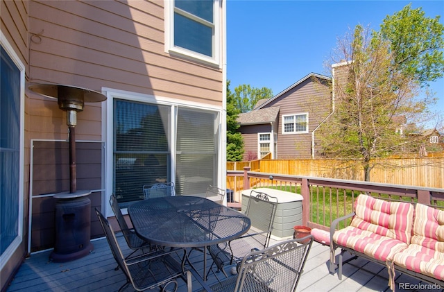 9688 Chesapeake St, Highlands Ranch, CO 80126 - wooden terrace with outdoor dining area and fence