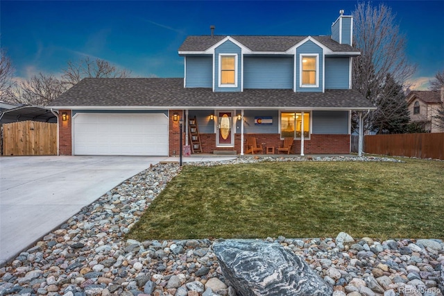 view of front facade featuring a lawn and a garage