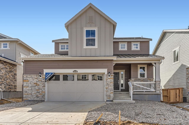 view of front of house with driveway, a standing seam roof, covered porch, board and batten siding, and metal roof