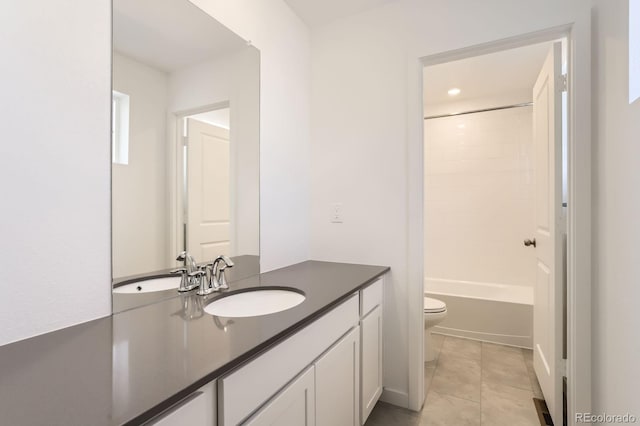 bathroom featuring tile patterned flooring, toilet, vanity, and washtub / shower combination