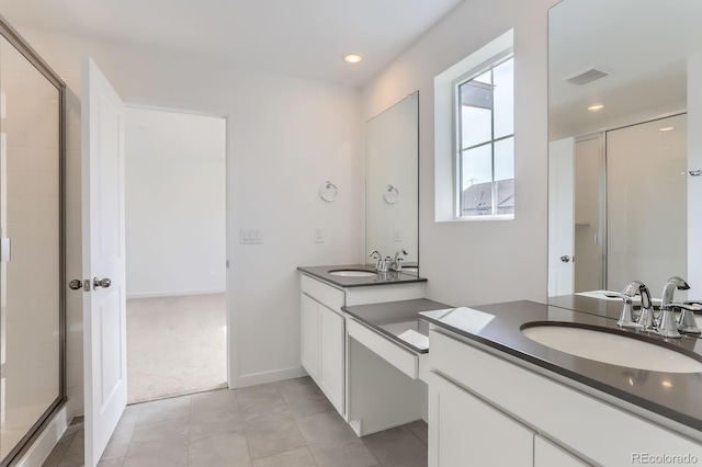 bathroom with visible vents, recessed lighting, a shower stall, tile patterned flooring, and vanity