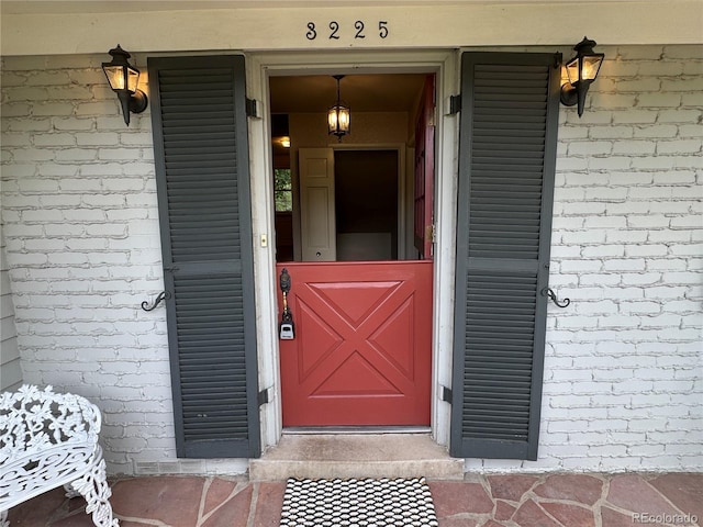 3225 S Race St, Englewood, CO 80113 - doorway to property featuring brick siding