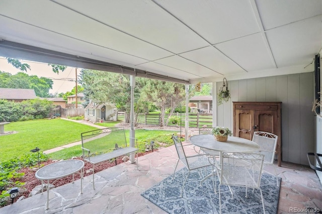 3225 S Race St, Englewood, CO 80113 - fenced backyard featuring a patio area, a storage unit, and outdoor dining space