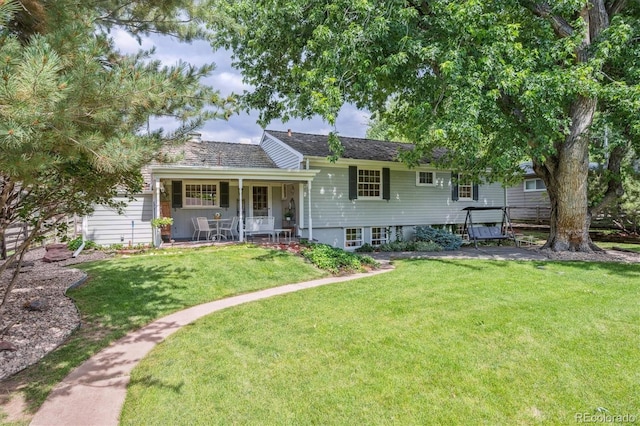 3225 S Race St, Englewood, CO 80113 - view of front of house featuring a front yard and covered porch