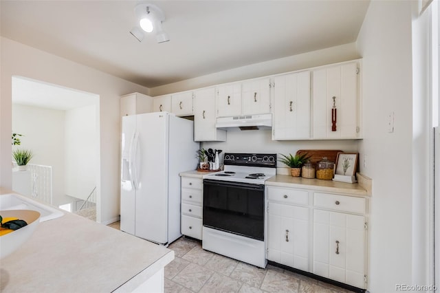 kitchen with white appliances and white cabinetry