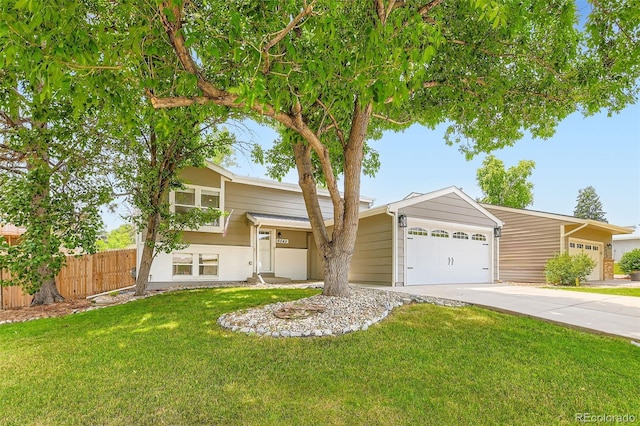 6040 W 75th Dr, Arvada, CO 80003 - view of front of home featuring an attached garage and concrete driveway