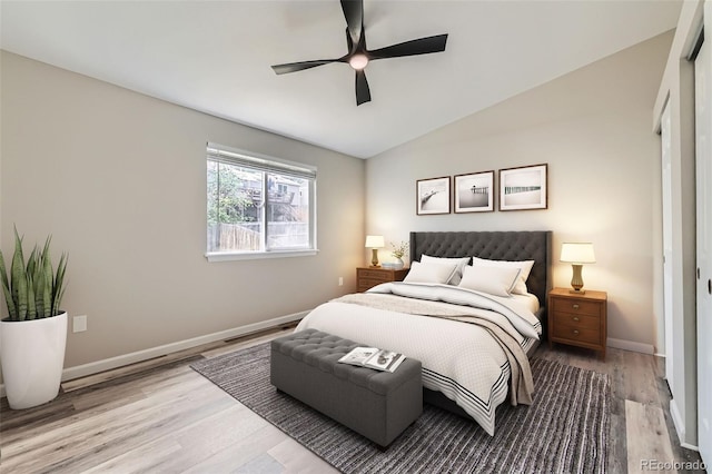 6040 W 75th Dr, Arvada, CO 80003 - bedroom with wood finished floors, lofted ceiling, and a ceiling fan