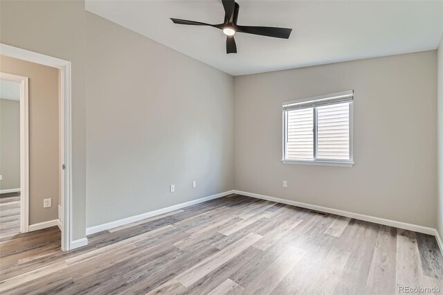 6040 W 75th Dr, Arvada, CO 80003 - empty room with a ceiling fan and wood finished floors